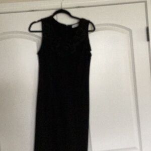black sleeveless Calvin Klein dress with ruffled neckline. Excellent condition.